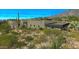 Expansive desert landscaping surrounds the modern home and architectural design at 41639 N 113Th Pl, Scottsdale, AZ 85262