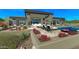 Backyard featuring patio seating, outdoor fireplace, spa, and a sparkling pool at 41639 N 113Th Pl, Scottsdale, AZ 85262