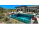 Backyard featuring pool with waterfall, spa, patio and desert landscaping at 41639 N 113Th Pl, Scottsdale, AZ 85262