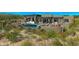 Pool area surrounded by desert landscaping, a fireplace and lots of room to enjoy the outdoors at 41639 N 113Th Pl, Scottsdale, AZ 85262