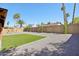 Landscaped backyard features gravel, artificial turf, and mature trees creating a tranquil outdoor setting at 4521 W Buffalo St, Chandler, AZ 85226