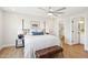Bright bedroom featuring a four-poster bed and a large window at 4521 W Buffalo St, Chandler, AZ 85226