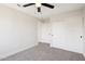 Neutral-toned bedroom features a sliding door closet, carpet, and leads to an adjoining room at 4521 W Buffalo St, Chandler, AZ 85226