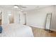 Bedroom featuring a large mirror and hardwood floors at 4521 W Buffalo St, Chandler, AZ 85226