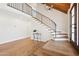 Open foyer with wood stairs and wrought iron railing at 4521 W Buffalo St, Chandler, AZ 85226