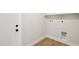 Empty laundry room with door and hookups at 4521 W Buffalo St, Chandler, AZ 85226