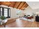 Bright living room featuring a vaulted ceiling, wood beams, and modern light fixtures at 4521 W Buffalo St, Chandler, AZ 85226