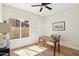 Bright room featuring wood floors, a desk, and a window overlooking an enclosed yard at 4521 W Buffalo St, Chandler, AZ 85226
