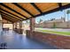 Covered patio area with brick supports and a well-maintained yard, offering an outdoor living space at 4521 W Buffalo St, Chandler, AZ 85226