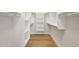 Spacious walk-in closet with custom shelving and hanging rods, providing ample storage space at 4521 W Buffalo St, Chandler, AZ 85226