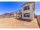 Exterior view of a two-story home featuring a spacious backyard and desert landscaping at 5016 W Brown St, Glendale, AZ 85302