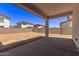 View of backyard with cinder block fence and covered patio at 5016 W Brown St, Glendale, AZ 85302