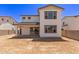 Two-story home featuring a spacious backyard with a covered patio at 5016 W Brown St, Glendale, AZ 85302