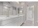 Bright bathroom with double sink vanity, large mirror, and tiled floors at 5016 W Brown St, Glendale, AZ 85302