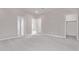 Spacious bedroom with neutral carpet and paint, multiple doorways, and ample natural light at 5016 W Brown St, Glendale, AZ 85302