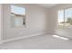 Bright bedroom with carpeted floors and view outside at 5016 W Brown St, Glendale, AZ 85302