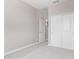 Neutral bedroom with carpeted floors and sliding closet doors at 5016 W Brown St, Glendale, AZ 85302