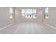 Spacious carpeted bedroom with multiple windows looking out to neighborhood at 5016 W Brown St, Glendale, AZ 85302