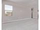 Large carpeted bedroom with view of neighborhood at 5016 W Brown St, Glendale, AZ 85302