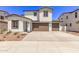 Beautiful two-story home with two-car garage, wide driveway, and desert landscaping at 5016 W Brown St, Glendale, AZ 85302