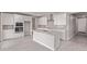 Stylish kitchen features white cabinets, an island, stainless steel appliances and a tiled backsplash at 5016 W Brown St, Glendale, AZ 85302