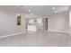 Open concept living space flows into kitchen featuring bright tile flooring and recessed lighting at 5016 W Brown St, Glendale, AZ 85302