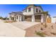 Street view of multiple two-story homes featuring desert landscaping and two-car garages at 5016 W Brown St, Glendale, AZ 85302