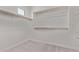 Spacious walk-in closet featuring carpeted floors and wooden clothes rods at 5016 W Brown St, Glendale, AZ 85302