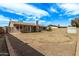 Expansive backyard featuring a brick border, a shed, and potential for customization at 5129 W Windrose Dr, Glendale, AZ 85304
