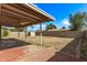 Spacious backyard with covered patio, block fence, and potential for landscaping at 5129 W Windrose Dr, Glendale, AZ 85304