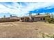 Wide backyard view showcasing a patio, chimney, and open space at 5129 W Windrose Dr, Glendale, AZ 85304