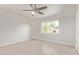 Bright bedroom featuring neutral tile flooring, a ceiling fan, and natural light from a window at 5129 W Windrose Dr, Glendale, AZ 85304