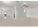 Bedroom featuring an en-suite bathroom, neutral flooring and a ceiling fan at 5129 W Windrose Dr, Glendale, AZ 85304