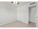 Bedroom featuring a closet with sliding doors and an ensuite bathroom at 5129 W Windrose Dr, Glendale, AZ 85304