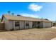 Inviting single-story home featuring a well-manicured front yard and stylish neutral color palette at 5129 W Windrose Dr, Glendale, AZ 85304
