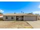 Charming single-story home with a well-maintained lawn and a classic design at 5129 W Windrose Dr, Glendale, AZ 85304
