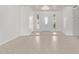 Inviting foyer featuring neutral tile flooring, and a stylish front door with side windows at 5129 W Windrose Dr, Glendale, AZ 85304