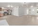 Open-concept living area featuring tile flooring and contemporary light fixtures at 5129 W Windrose Dr, Glendale, AZ 85304