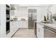 Modern kitchen with stainless steel appliances and white cabinetry at 5250 E Deer Valley Dr # 440, Phoenix, AZ 85054