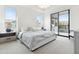 Bright bedroom with large windows, plush carpet, and access to a private balcony at 5250 E Deer Valley Dr # 440, Phoenix, AZ 85054
