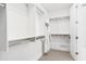 Bright walk-in closet with custom shelving, carpet flooring, and convenient access to storage solutions at 5250 E Deer Valley Dr # 440, Phoenix, AZ 85054
