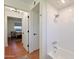 Bathroom with a white tiled shower and easy access to the adjacent bedroom at 5550 N 12Th St # 2, Phoenix, AZ 85014