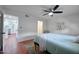 Bright bedroom with terracotta flooring, ceiling fan, and view of kitchen at 5550 N 12Th St # 2, Phoenix, AZ 85014