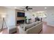 Inviting living room features a fireplace, TV, and modern ceiling fan at 5550 N 12Th St # 2, Phoenix, AZ 85014