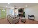 Bright living room with a green front door, modern fireplace, and stylish furniture at 5550 N 12Th St # 2, Phoenix, AZ 85014