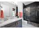 Modern bathroom with a glass shower, stylish vanity, and elegant fixtures at 6321 N Camelback Manor Dr, Paradise Valley, AZ 85253