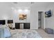 Cozy bedroom featuring a wet bar, mounted television, and comfortable sleeping arrangement at 6321 N Camelback Manor Dr, Paradise Valley, AZ 85253