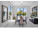 Bright dining room features large windows, modern lighting fixture, and sleek furniture at 6321 N Camelback Manor Dr, Paradise Valley, AZ 85253