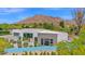 Home exterior view with desert landscaping, mountain views, and modern architectural design at 6321 N Camelback Manor Dr, Paradise Valley, AZ 85253