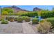 Landscaped walkway and desert landscaping lead to the home's entrance, creating curb appeal at 6321 N Camelback Manor Dr, Paradise Valley, AZ 85253